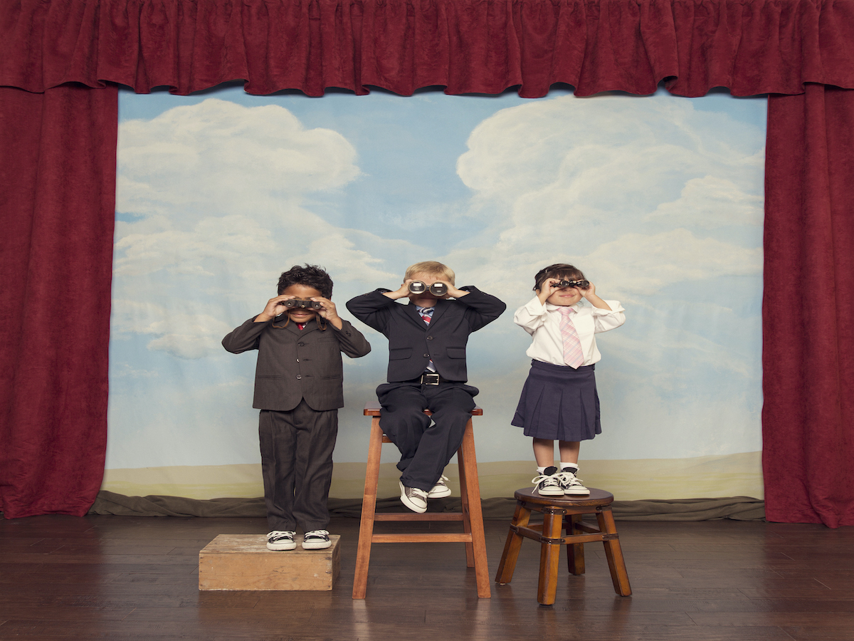 Business Children Look For Profits Through Binoculars